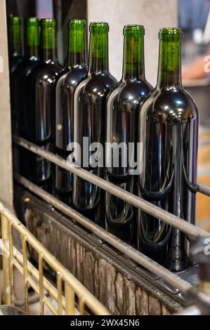 Wine making line, bottling and corking line in underground cellar, Saint-Emilion wine making region picking, cru class Merlot or Cabernet Sauvignon re Stock Photo