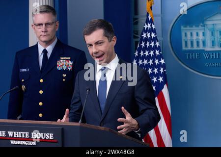 US Secretary of Transportation Pete Buttigieg (R); and Deputy Commandant for Operations for the United States Coast Guard, Vice Admiral Peter Gautier (L); participate in a news conference in the James Brady Press Briefing Room of the White House, in Washington, DC, USA, 27 March 2024. US Secretary of Transportation Pete Buttigieg and Deputy Commandant for Operations for the United States Coast Guard, Vice Admiral Peter Gautier, attended the news conference to discuss the collapse of the Francis Scott Key Memorial Bridge, which left six presumed dead after a cargo ship struck the bridge and des Stock Photo