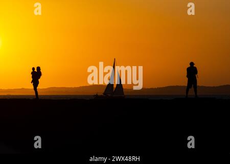 Salvador, Bahia, Brazil - March 15, 2019: People are seen on top of the Porto da Barra pier against the sunset in the city of Salvador, Bahia. Stock Photo