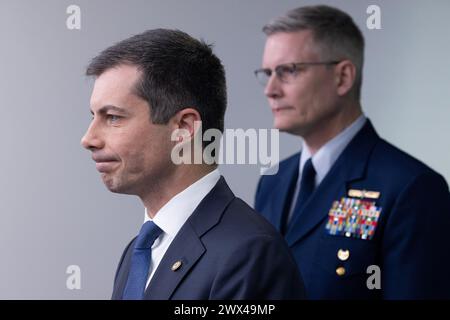 US Secretary of Transportation Pete Buttigieg (L) and Deputy Commandant for Operations for the United States Coast Guard, Vice Admiral Peter Gautier (R) participate in a news conference in the James Brady Press Briefing Room of the White House, in Washington, DC, on Wednesday, March 27, 2024. US Secretary of Transportation Pete Buttigieg and Deputy Commandant for Operations for the United States Coast Guard, Vice Admiral Peter Gautier, attended the news conference to discuss the collapse of the Francis Scott Key Memorial Bridge, which left six presumed dead after a cargo ship struck the bridge Stock Photo