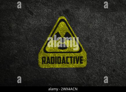 Radioactive sign on grey stone wall. Hazard symbol Stock Photo