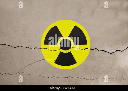 Radioactive sign on old cracked wall. Hazard symbol Stock Photo