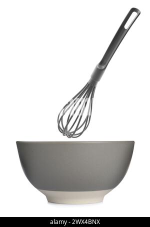 Plastic whisk and ceramic bowl isolated on white. Cooking utensils Stock Photo