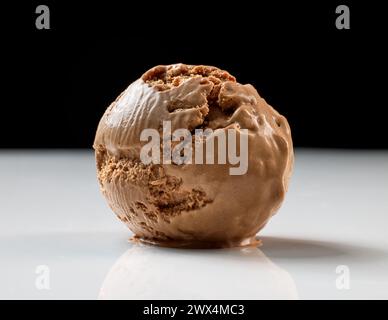 homemade chocolate ice cream scoop on black and white background, melting Stock Photo