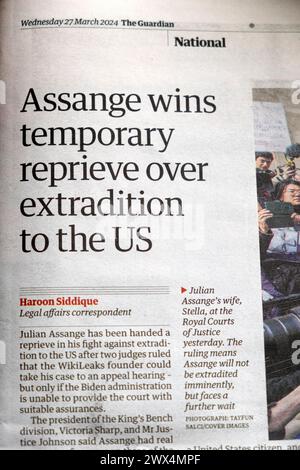 Julian 'Assange wins temporary reprieve over extradition to the US' Guardian newspaper headline 27 March 2024 WikiLeaks article London England UK Stock Photo