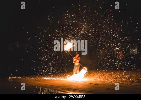 Koh Chang, Trat Province, Thailand. 3rd Jan, 2024. A fire dancer is seen juggles with fire during a fire show, on Koh Chang Island. Fire shows also called fire dance are deeply rooted in Thai culture and has its origins in ancient rituals and traditions. The art of fire dancing was once exclusive to temples and religious ceremonies but, over time, fire dancing has evolved into a form of entertainment, captivating locals and tourists alike. (Credit Image: © Nathalie Jamois/SOPA Images via ZUMA Press Wire) EDITORIAL USAGE ONLY! Not for Commercial USAGE! Stock Photo