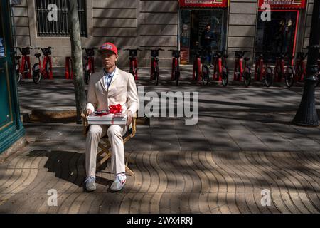 The wax figure of the American actor Tom Hanks is seen placed as an entrance attraction to the museum on Barcelona's Rambla. Barcelona has a hotel occupancy rate of over 80% planned for the Easter holidays. For residents, the increase in visitors and tourists in the streets and squares visiting the city's architectural heritage during Holy Week is already noticeable. Stock Photo