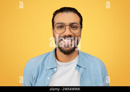 Happy Indian man smiling against a white background Stock Photo - Alamy