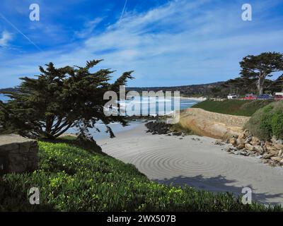 Carmel, California, USA  March 22nd 2024  A view of Carmels ÒlittleÓ beach at the bottom of 13th Street, showing the sand circles made by creative peo Stock Photo