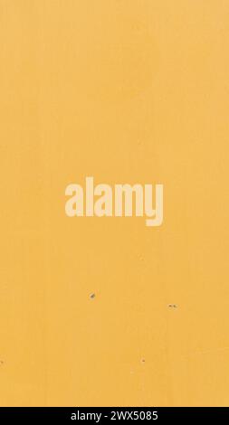 Yellow backdrop, textured surface, creative potential Stock Photo
