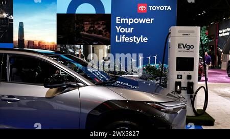 New York, United States. 27th Mar, 2024. Toyota BZ4X charging from a EVGo station during press day at the New York International Auto Show on March 27, 2024 in New York City. The show first opened in 1900 at the New York Coliseum, moving to the Javits Center 87 years later where manufacturers display their new models and concept vehicles . (Photo by John Lamparski/NurPhoto) Credit: NurPhoto SRL/Alamy Live News Stock Photo