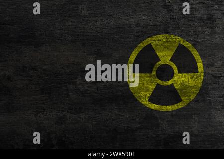 Radioactive sign on black stone wall, space for text. Hazard symbol Stock Photo