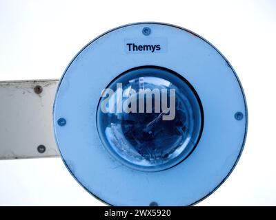Haguenau, France - Mar 20, 2024: A surveillance camera named Themys mounted at a train station, focused on maintaining security and monitoring activities Stock Photo