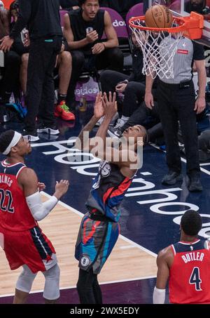 Washington, USA. 27th Mar, 2024. WASHINGTON, DC - MARCH 27: Brooklyn Nets center Nic Claxton (33) flips in a shot over his head during a NBA game between the Washington Wizards and the Brooklyn Nets, on March 27, 2024, at Capital One Arena, in Washington, DC. (Photo by Tony Quinn/SipaUSA) Credit: Sipa USA/Alamy Live News Stock Photo