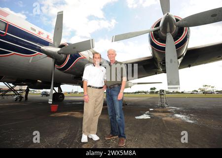 MIAMI, FL - NOVEMBER 17: Captain 'Sully' Sullenberger and Co-pilot Jeff Skiles pose with the Historical 1958 DC7 for a benefit hosted by Historical Flight Foundation. Chesley Burnett 'Sully' Sullenberger, III (born January 23, 1951) is a retired airline captain and aviation safety consultant. He was hailed as a national hero in the United States when he successfully executed an emergency water landing of US Airways Flight 1549 in the Hudson River off Manhattan, New York City, after the aircraft was disabled by striking a flock of Canada geese during its initial climb out of LaGuardia Airport o Stock Photo