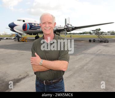 MIAMI, FL - NOVEMBER 17: Captain 'Sully' Sullenberger and Co-pilot Jeff Skiles pose with the Historical 1958 DC7 for a benefit hosted by Historical Flight Foundation. Chesley Burnett 'Sully' Sullenberger, III (born January 23, 1951) is a retired airline captain and aviation safety consultant. He was hailed as a national hero in the United States when he successfully executed an emergency water landing of US Airways Flight 1549 in the Hudson River off Manhattan, New York City, after the aircraft was disabled by striking a flock of Canada geese during its initial climb out of LaGuardia Airport o Stock Photo