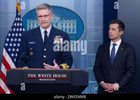 Deputy Commandant for Operations for the United States Coast Guard, Vice Admiral Peter Gautier (L); and US Secretary of Transportation Pete Buttigieg (R); participate in a news conference in the James Brady Press Briefing Room of the White House, in Washington, DC, USA, 27 March 2024. US Secretary of Transportation Pete Buttigieg and Deputy Commandant for Operations for the United States Coast Guard, Vice Admiral Peter Gautier, attended the news conference to discuss the collapse of the Francis Scott Key Memorial Bridge, which left six presumed dead after a cargo ship struck the bridge and des Stock Photo
