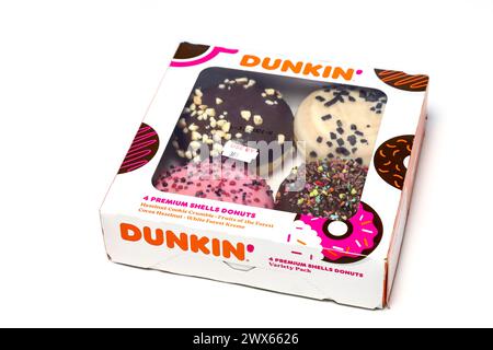 Dunkin' Donuts, Box of donuts isolated on a white studio background. Stock Photo