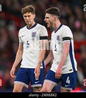 23 Mar 2024 - England v Brazil - International Friendly - Wembley Stadium. England's Declan Rice and John Stones in action against Brazil.  Picture : Mark Pain / Alamy Live News Stock Photo