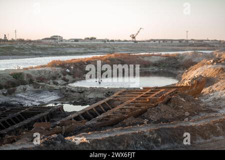 Wreckage of fishing boat in the abandoned harbor of Aralsk, Kazakhstan. Stock Photo
