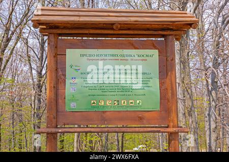 Sopot, Serbia - April 13, 2020: Wooden Information Board Monument to WWII Partisans Soldiers at Kosmaj Mountain. Stock Photo