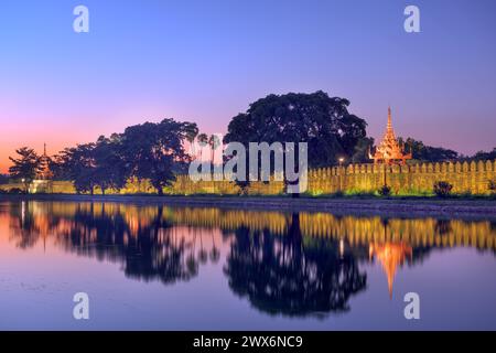 Mandalay, Myanmar at the royal palace moat at dusk. Stock Photo