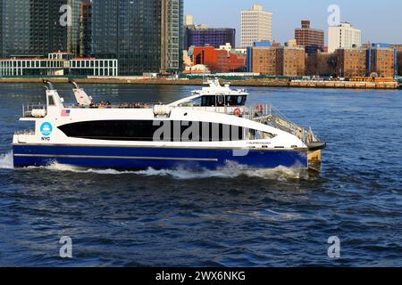 NYC Ferry ferryboat Koalafied Cruiser on the East River, New York City. NYC Ferry is operated by Hornblower Cruises with subsidies from the city. Stock Photo