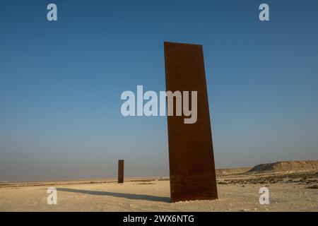 Brouq, Qatar. 28th Mar, 2024. File photo dated November 19, 2021 shows the ‘East-West/West-East' sculpture by American artist Richard Serra, in Qatar's Brouq nature reserve, one hour drive west of the capital Doha. The work is composed of four steel plates, each over fourteen metres in height, in the middle of the desert. Richard Serra just passed away, in March 2024, at the age of 85. Photo by Balkis Press/ABACAPRESS.COM Credit: Abaca Press/Alamy Live News Stock Photo