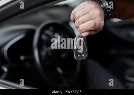 Man's Hand Holds The Car Keys. Buying And Selling Cars. Test Drive Stock Photo