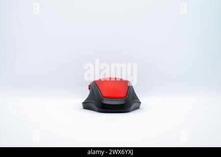 A sleek red mouse on a clean white background, blending style with precision for seamless computer navigation. Stock Photo