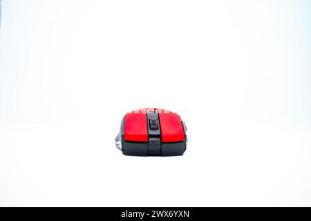A sleek red mouse on a clean white background, blending style with precision for seamless computer navigation. Stock Photo