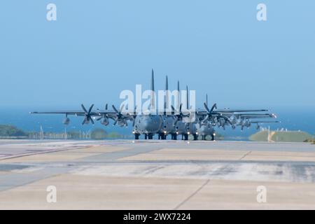 Five MC-130J Commando IIs assigned to the 1st Special Operations Squadron taxi before the Flight of the Flock training event at Kadena Air Base, Japan Stock Photo