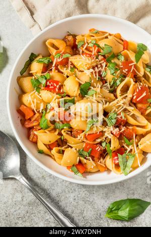 Italian Homemade Chonchiglie Pasta with Tomato and Basil Stock Photo