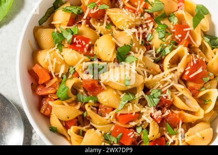 Italian Homemade Chonchiglie Pasta with Tomato and Basil Stock Photo