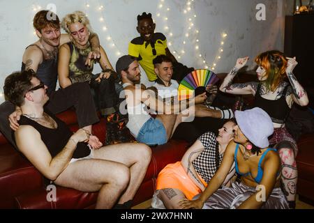 Group of multiracial non-binary friends having fun during party at nightclub Stock Photo