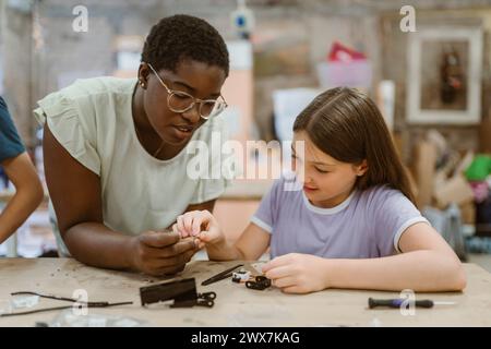 Teacher in a robotics engineering class Stock Photo - Alamy