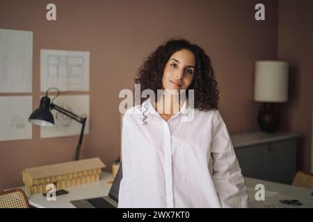 Portrait of confident female architect wearing white shirt at office Stock Photo