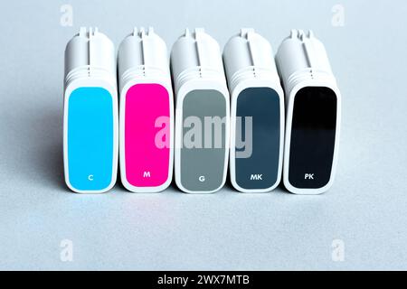 Cartridges color for wide format plotter on grey background Stock Photo