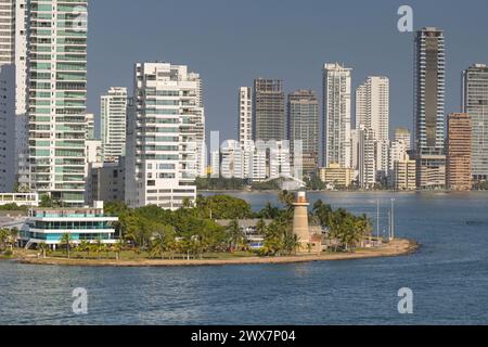 Cartagena, Colombia - 24 January 2024: Naval Club and lighthouse at the entrance to the city's port Stock Photo