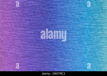 Multicolor crepe paper with gradient texture. It si occupies the entire surface of the image. Close-up. Stock Photo