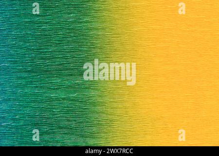 Multicolor crepe paper with gradient texture. It si occupies the entire surface of the image. Close-up. Stock Photo