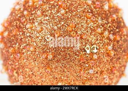 The texture is made of crushed fine golden glass and beads. Fragments of this image can be used as textures. Close-up. Stock Photo