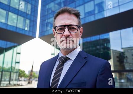 Portrait of a mature businessman looking at camera carefree. Stock Photo