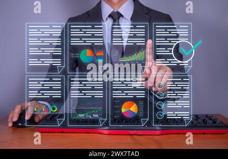 manager reviews business data online. digital document management. The paperless office concept is highlighted. Stock Photo