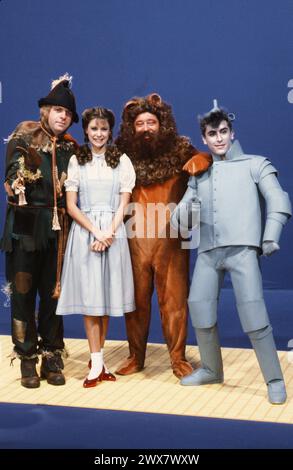 French TV presenter Dorothée on the set of the TV variety show 'Dorothée Show' broadcast in 1983 on TF1. From left to right, dressed as characters from The Wizard of Oz: Jacky, Dorothée, Carlos and Albert Kassabi. Stock Photo