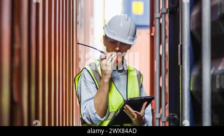 Construction worker in safety gear with a clipboard Stock Photo