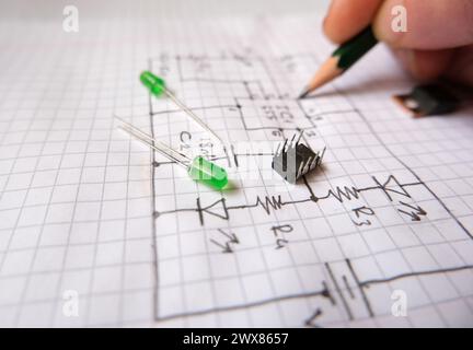 Hand drawn electronic circuit diagram and semiconductor components. Project planning, design and production in electric - electronic industry. Selecte Stock Photo