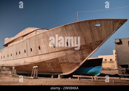 Yacht at wharf under construction Stock Photo