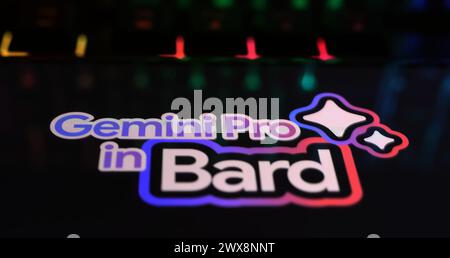 Viersen, Germany - March 9. 2024: Closeup of smartphone on computer keyboard with logo lettering of Gemini pro in Bard Stock Photo