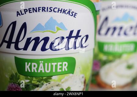 Viersen, Germany - March 9. 2024: Closeup of Almette spread herb cheese logo lettering Stock Photo